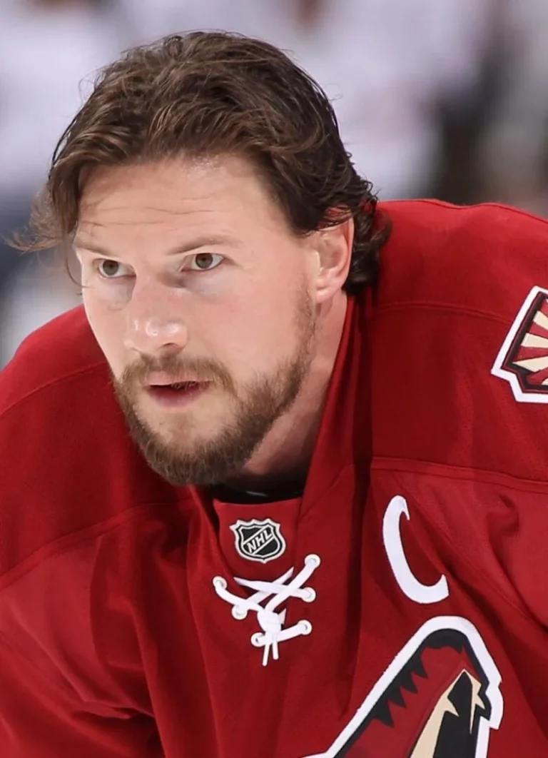 A close up of a hockey player with a beard